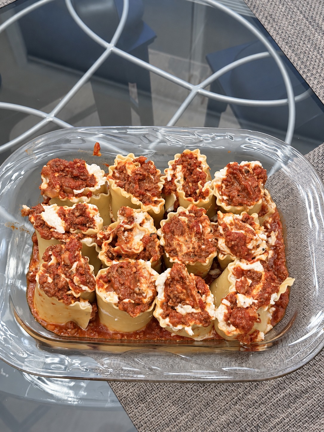 Arrange the rolls snugly together, tucking leftover cheese mixture between them.