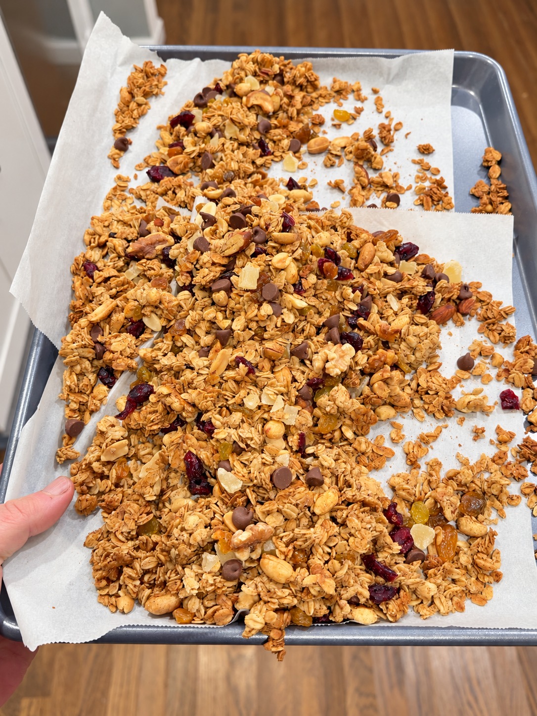 The full tray of finished granola with all fruit, nuts, and chocolate mixed in